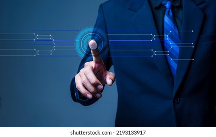 Security Concepts And Innovative Biometric Technologies. Man Wearing Suit And Tie Is Using Fingerprint To Access Personal Touch ID.