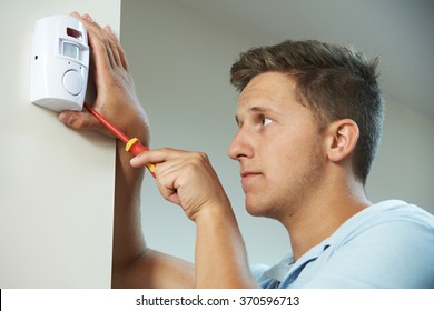 Security Consultant Fitting Burglar Alarm Sensor In Room - Shutterstock ID 370596713