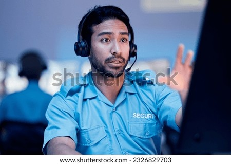 Security dispatch, computer and man with problem, emergency and monitor CCTV, surveillance or crime. Safety officer, support consultation and law person reading, chat and consulting about 911 crisis