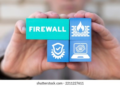 Security firewall technology concept. Businessman holding styrofoam blocks with icons and inscription: FIREWALL.