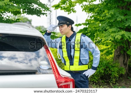 Security guard checking a suspicious car