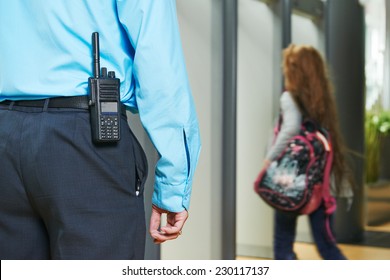 Security Guard Controlling Indoor Entrance Gate