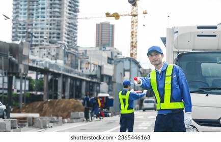 Security guard controlling traffic at a construction site.
