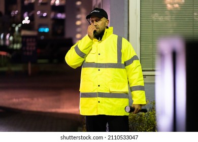 Security Guard At Entrance Gate At Night