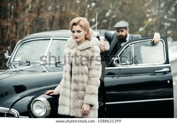 security guard of luxury woman. securoti guard man
and girl in retro car