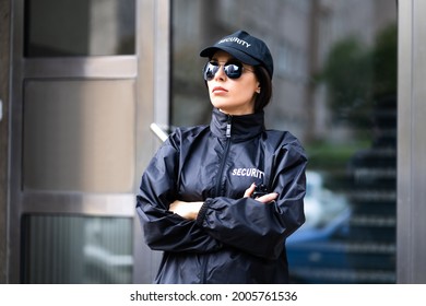 Security Guard Officer In Uniform. Guard Service Woman Standing - Powered by Shutterstock