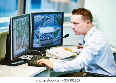 Security Guard Officer Watching Video Monitoring Surveillance Security System