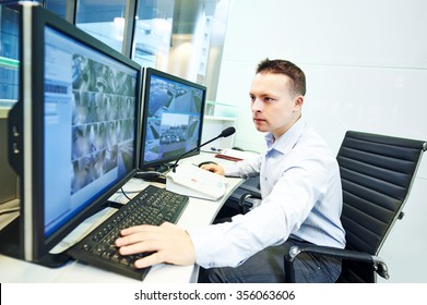 Security Guard Officer Watching Video Monitoring Surveillance Security System