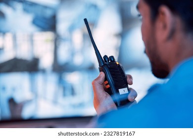 Security guard, radio and cctv monitor, communication and inspection service for building safety. Screen, video surveillance agency and law officer in control room talking on two way intercom system.