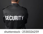 Security guard in uniform on black background, closeup