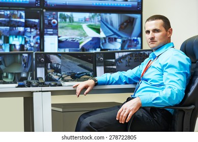 Security Guard Watching Video Monitoring Surveillance Security System