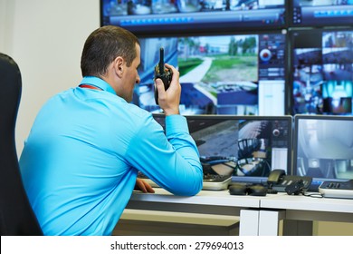 Security Guard Watching Video Monitoring Surveillance Security System