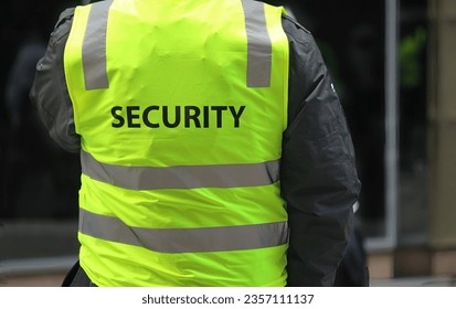 A security guard wearing a high vis vest - Powered by Shutterstock