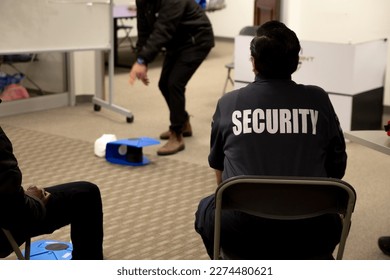 Security guards are learning how to use fire alarm panel