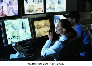 Security guards monitoring modern CCTV cameras in surveillance room - Shutterstock ID 1311037289