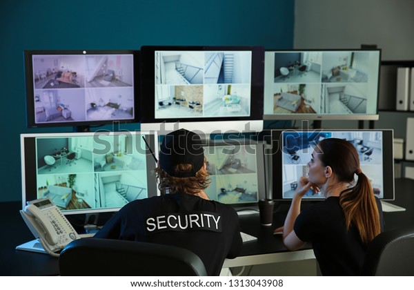 Security Guards Monitoring Modern Cctv Cameras Stock Photo