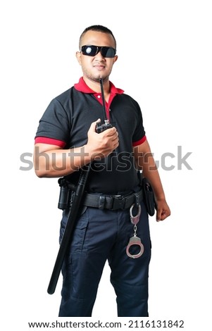 Security guards wear dark glasses. stand holding a radio There are rubber batons and handcuffs on the tactical belt. on isolated white background cut out security concept