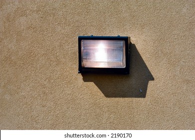 Security light mounted on a concrete wall