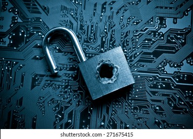 security lock with a hole on computer circuit board - computer security concept