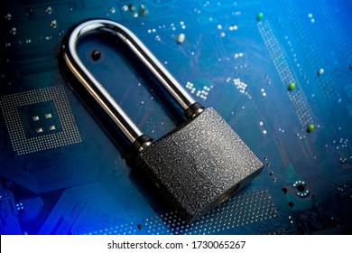 Security lock on computer circuit board - computer security concept.