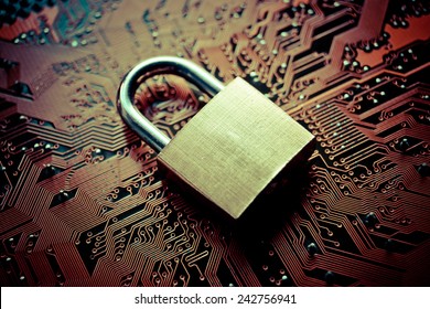 security lock on computer circuit board - computer security concept