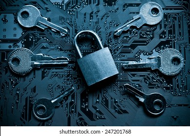 a security lock on a computer circuit board surrounded by keys / random password hacking concept