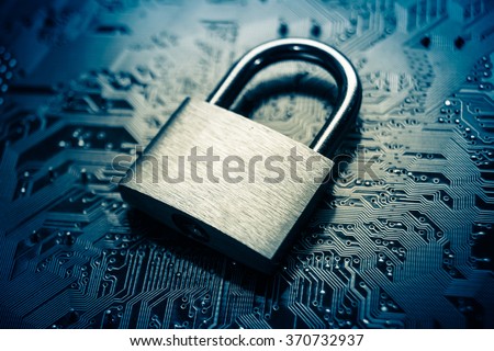 security lock on computer circuit board - computer security concept