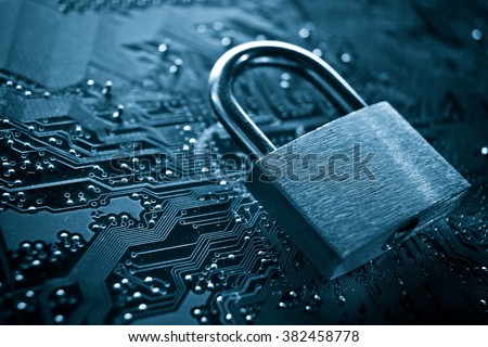 security lock on computer circuit board - computer security concept