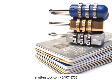 Security locks with password on piles of credit cards / Credit card data encryption concept