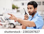 Security man, radio and point in street for inspection, law or warning with call, backup and city. Police officer, outdoor and communication to stop crime on walkie talkie, public services or safety