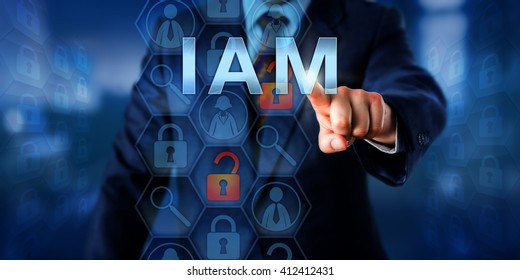 Security Manager Is Pushing IAM On A Touch Screen Interface. Information Technology Security Concept For Identity And Access Management That Is Controlling Access Rights To Data Resources.