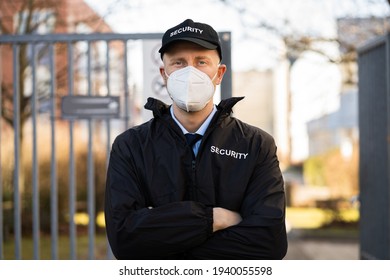 Security Officer In Covid Face Mask Outside Building