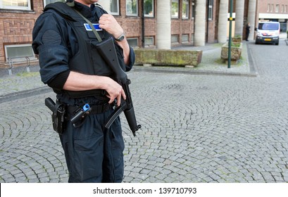 A Security Officer Is Protecting A Building