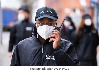 Security Officer Staff Group At Event In Face Mask