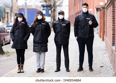 Security Officer Staff Group At Event In Face Mask