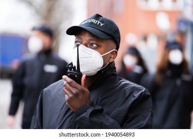 Security Officer Staff Group At Event In Face Mask