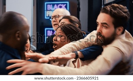 Security officer talking to rude people shoppers waiting for black friday shopping spree event, trying to stop customers from entering department store. Aggressive mad clients crowd.
