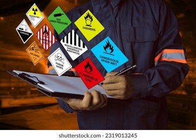 Security officers hold clipboards and inspect the storage of dangerous goods hazard substance in the warehouse for operator safety such as explosions, radioactive, toxic gases, etc.