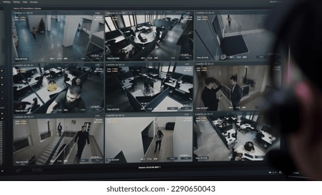 Security operator controls CCTV cameras in business office, uses digital tablet with surveillance cameras playback on screen. High tech security with facial recognition. Monitoring and social safety. - Shutterstock ID 2290650043