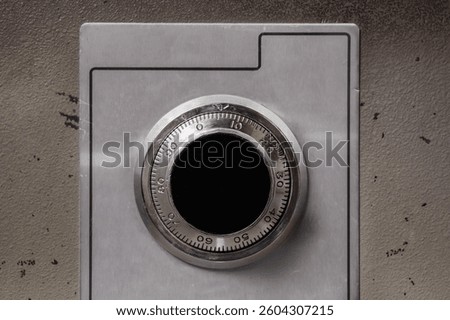 Security safe with mechanical combination lock or dial safe lock. Close up.Wheel combination lock with analog numbers. Close up of old fire proof steel safe. Selective focus.