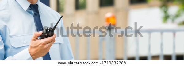 Security\
Service Guard Man Holding Walkie-Talkie New\
Gate