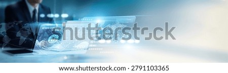 Security specialist using a laptop to implement network security solutions, intrusion detection, encryption, firewall systems, monitoring, risk management, secure access, and cyber defense.