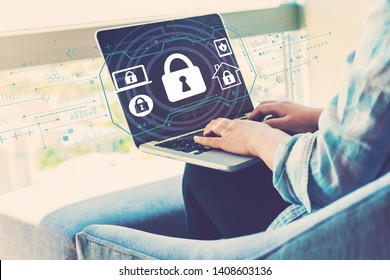 Security theme with woman using her laptop in her home office