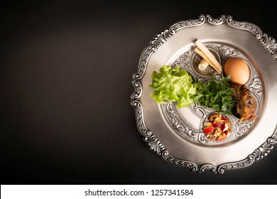 Seder, Dinner On The Occasion Of Passover. Seder Plate On A Black Background