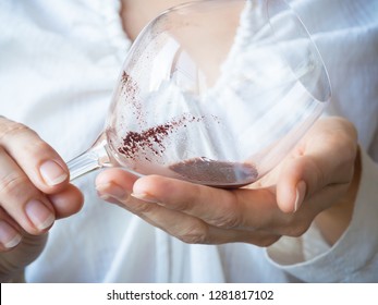 Sediment in a glass of old wine. Sediment in wine.