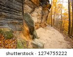 Sedimentary rock outcrop of the Ritchie Ledges along a hiking trail in Cuyahoga Valley National Park near Cleveland, Ohio, in late autumn.