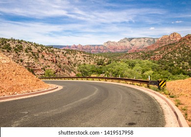 Sedona Arizona. Hairpin Curve On Winding Mountain Road Through The Breathtaking Scenery Of Red Rock Sandstone Mountains And Buttes.