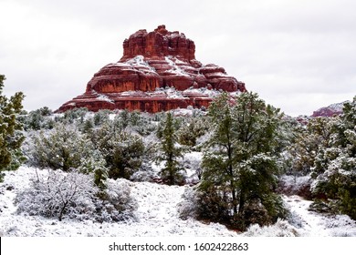Sedona Bell Rock Snow. Bell Rock in Sedona, Arizona surrounded by fresh snow. Sedona red rock and high desert juniper and pines in the winter landscape. Desert winter. 