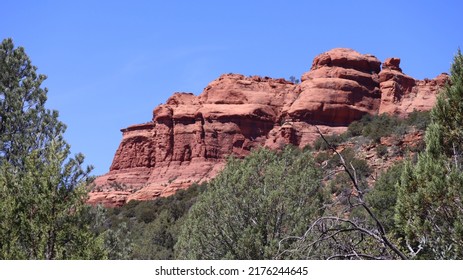 Sedona Red Rock Formation Framed By Trees