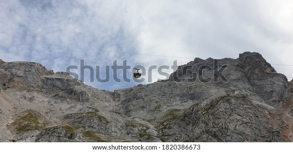 to see the dachstein\
west mountain range in styria austria is the mountain range and the\
cable car